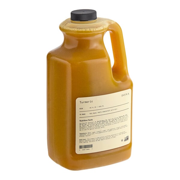A large bottle of Dona Turmeric Golden Latte concentrate on a white background.