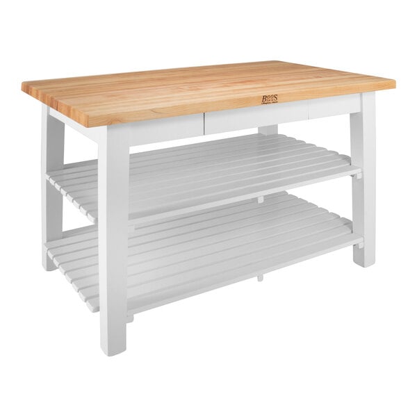 A white kitchen island with a wooden top and two shelves.