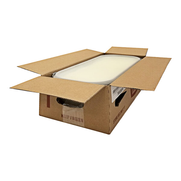 A cardboard box with a white G.S. Gelato Limoncello Sorbet container inside.