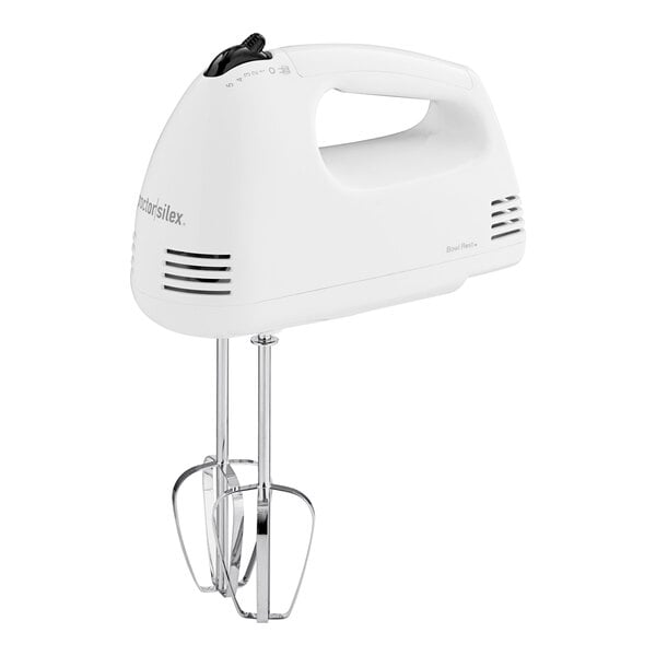 A white Proctor Silex hand mixer with a cord attached.