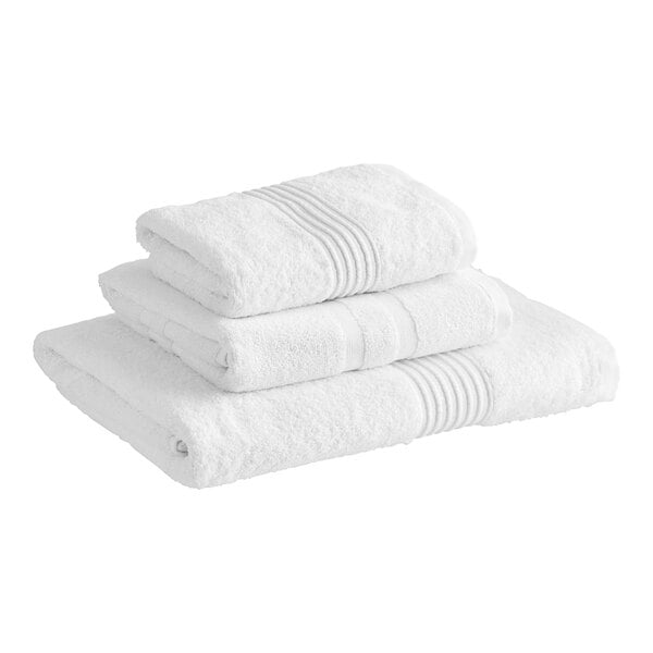 A stack of white Lavex Luxury towels.