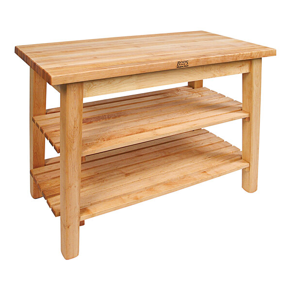 A John Boos natural maple wood work table with 2 shelves.