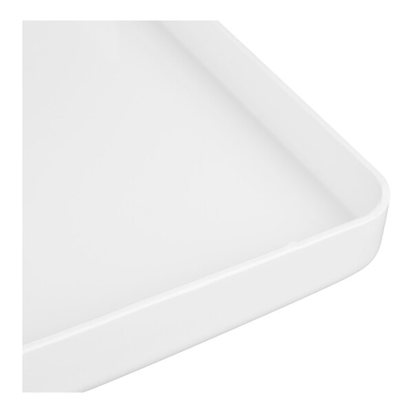 A close-up view of a white, rectangular tray with rounded edges.