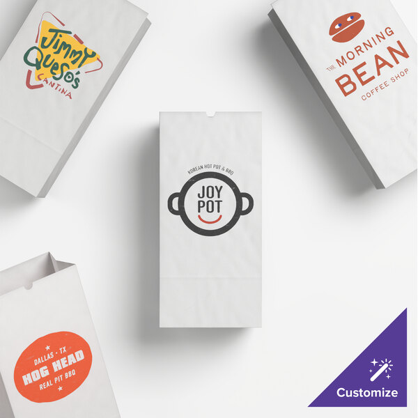A set of customizable white paper bags featuring various printed restaurant logos and designs.