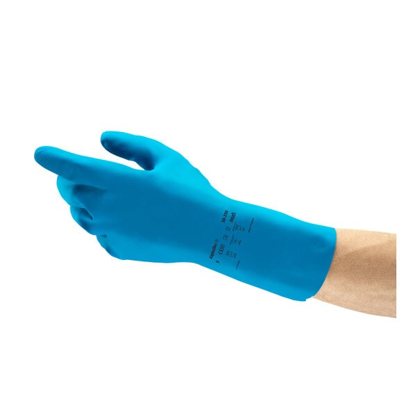 A blue natural latex rubber glove with a fish scale grip, shown on a person's hand.