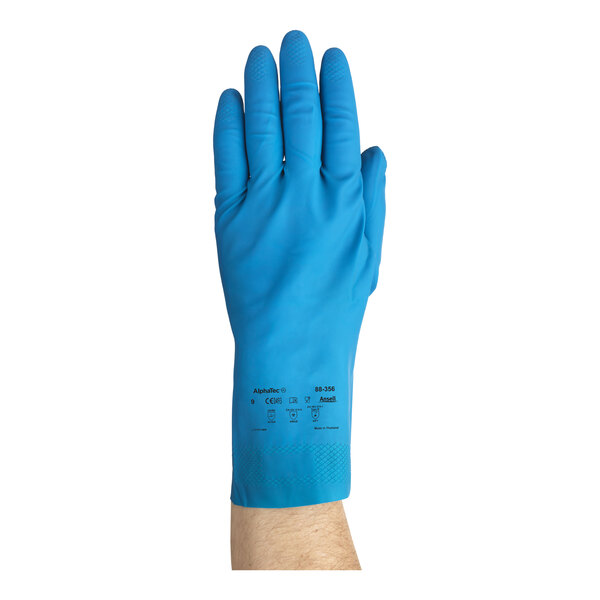 A blue natural latex rubber glove with a fish scale grip, shown worn on a hand.
