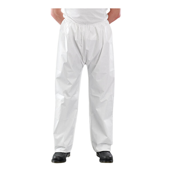 An extra-large Ansell AlphaTec white microporous trousers with elastic waist and ankles worn by a person.