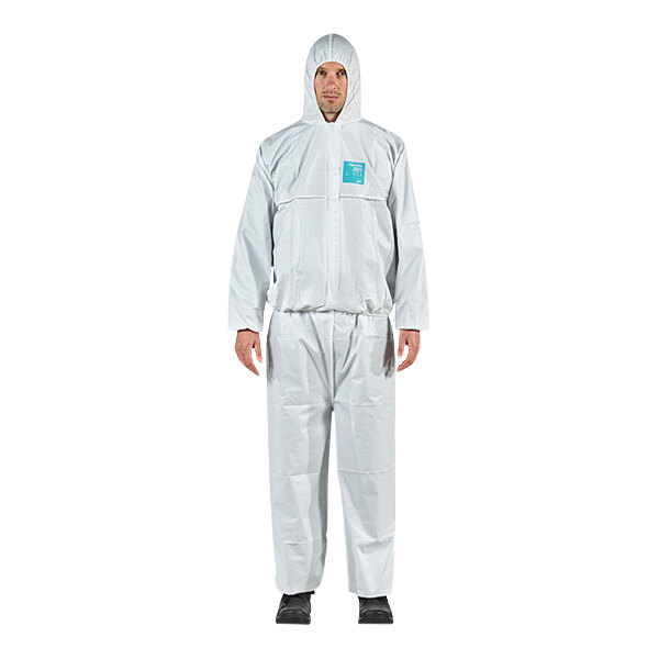A man wearing a white Ansell AlphaTec jacket and trouser set with a blue logo.