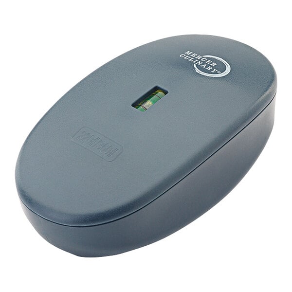 A grey rectangular Mercer Culinary Diamond Flattening Stone with a circular level on it.