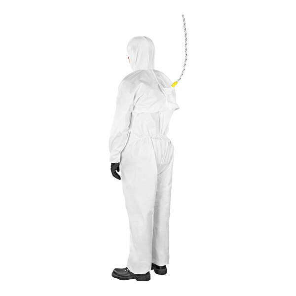 A person wearing a white Ansell AlphaTec fall arrest coverall.