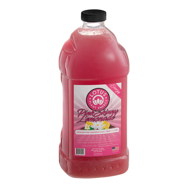 A bottle of Lotus Plant Energy Skinny Pink Lemonade concentrate with a pink label and lid.