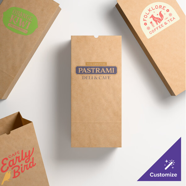 A set of natural kraft paper bags with customizable printed designs for businesses.