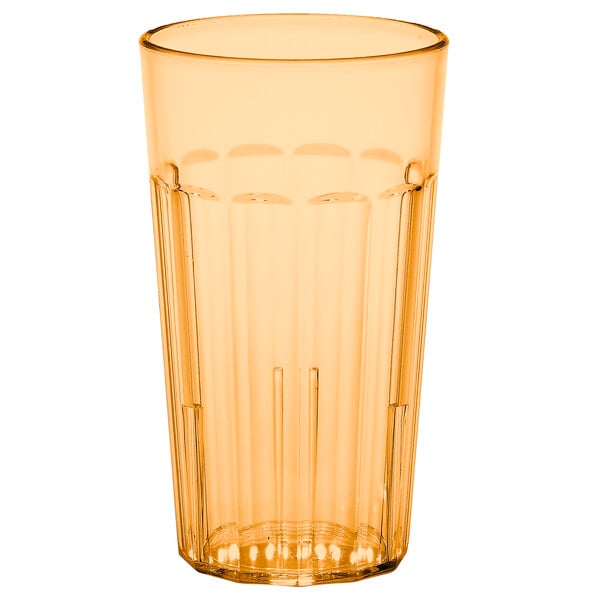 A clear plastic tumbler with an amber rim.