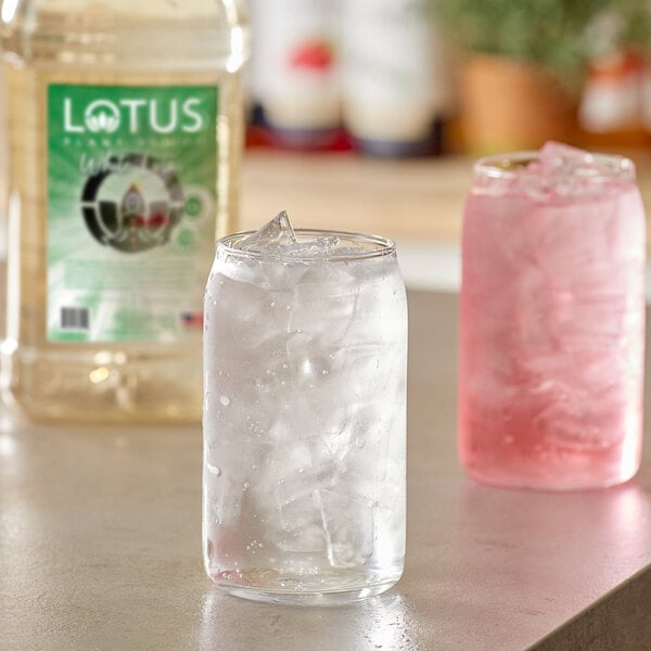 A clear glass jar with ice and Lotus Plant Power White Lotus Energy Concentrate.