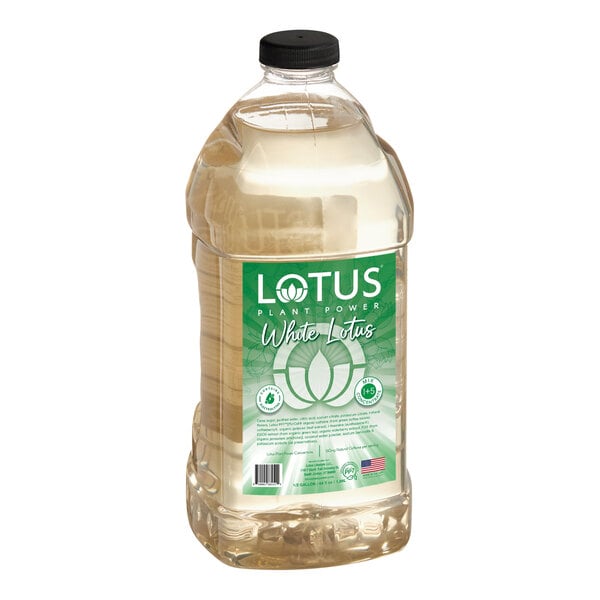 A large clear plastic bottle with a black cap, containing a light-colored liquid and a green label that reads 'Lotus Plant Power White Lotus 5:1 Energy Concentrate 64 fl. oz.'