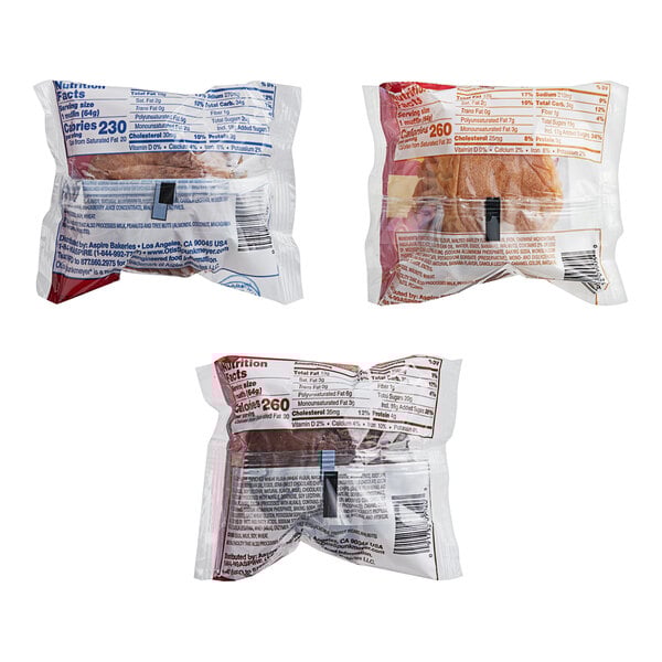 A close-up of three Otis Spunkmeyer packages of muffins.