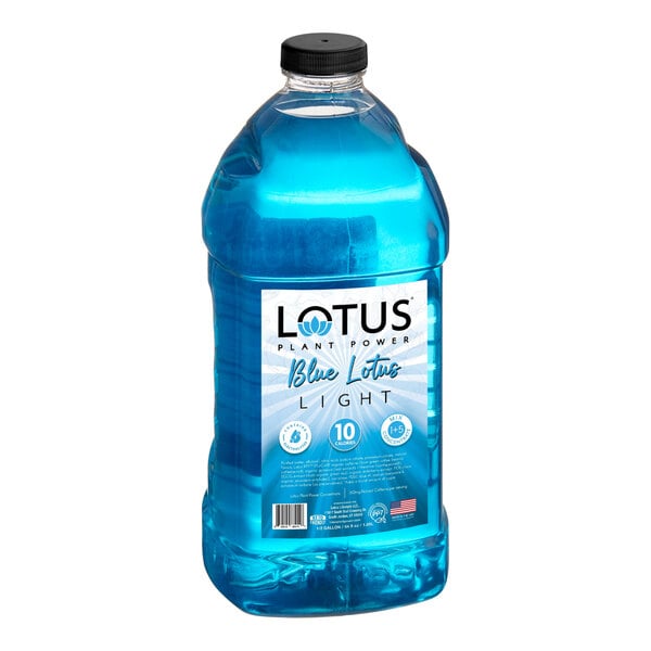 A large clear plastic bottle filled with blue liquid and labeled 'Lotus Plant Power Blue Lotus Light' with additional product information on the front.