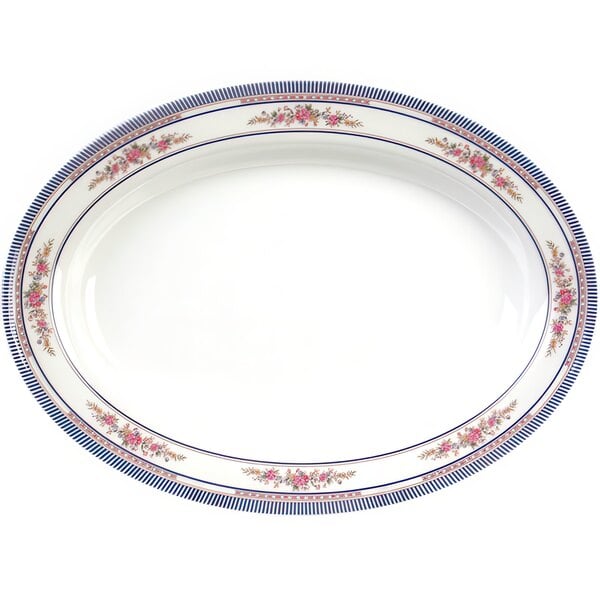 A white oval melamine platter with blue and pink roses and blue trim.