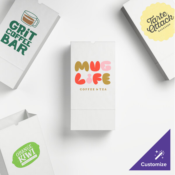 A selection of customizable white paper bags with various printed designs and logos.