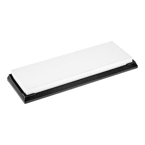 A white rectangular glass sharpening stone with black base.