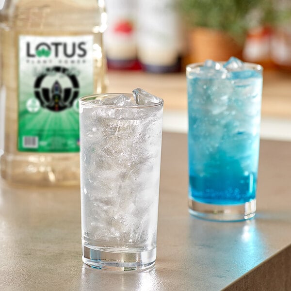 A glass of ice with blue Lotus Energy Concentrate.