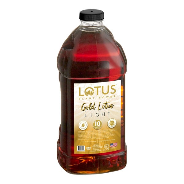 A large clear plastic bottle filled with a dark amber liquid and labeled 'Lotus Plant Power Gold Lotus Light' with gold and white accents.