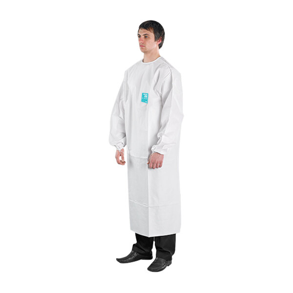 A man wearing a white Ansell AlphaTec protective apron with sleeves and a collar.