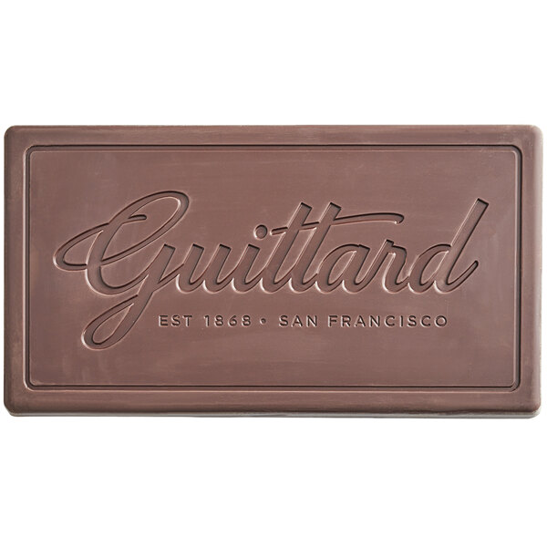 A Guittard Solitaire 54% Dark Chocolate bar on a table.