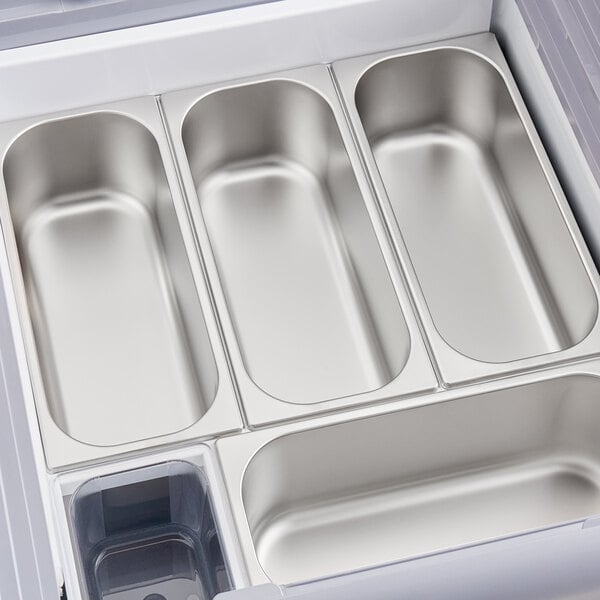 An Avantco stainless steel gelato dipping cabinet with four compartments.