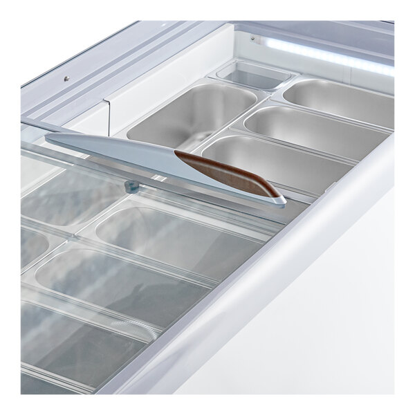 An Avantco gelato dipping cabinet with a glass lid and a handle.