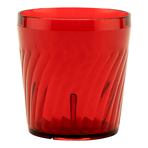 A red plastic tumbler with a curved design.