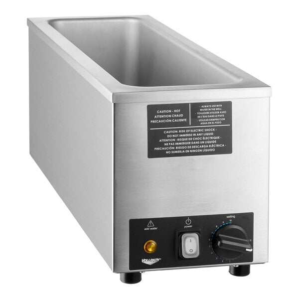 A stainless steel half size countertop food warmer with control knob and indicator lights.
