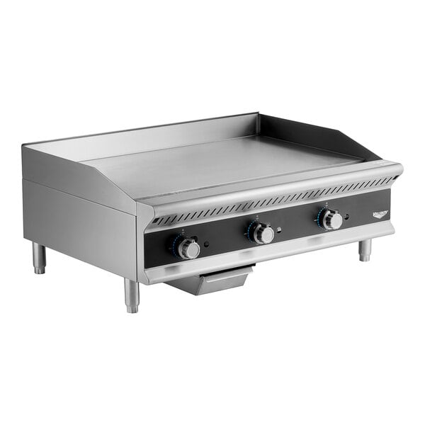 A Vollrath stainless steel countertop griddle with manual controls.