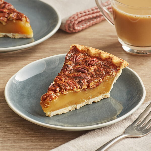 A slice of Chef Pierre Southern Pecan Pie on a plate with a fork.