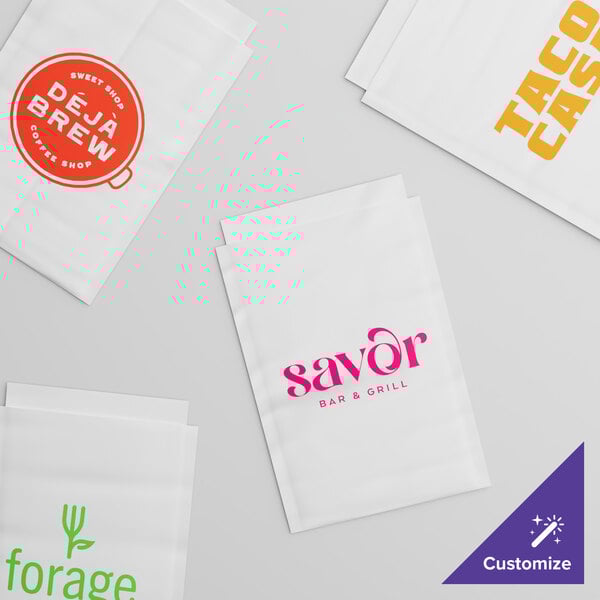 A group of white Vela layflat shipping bags with customizable text.