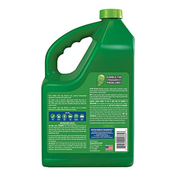 A green container of Green Gobbler Liquid Drain Clog Dissolver with a green lid and handle.