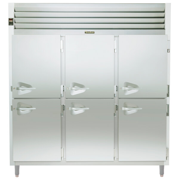 A white Traulsen reach-in refrigerator with four half doors and handles.