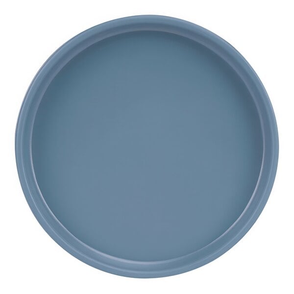 A close-up of a Cal-Mil stone blue melamine plate with a raised rim.