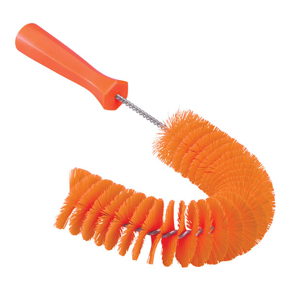 An orange Vikan pipe brush with a plastic handle.