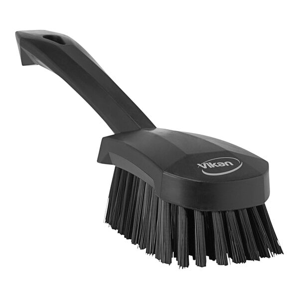 A Vikan black washing brush with a handle.