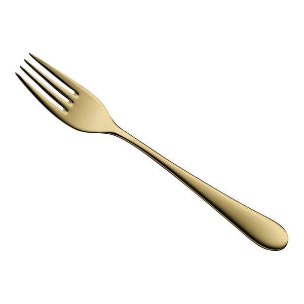 A close-up of a WMF Signum Gold stainless steel table fork with a white background.