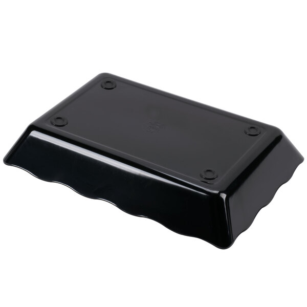 A black rectangular scalloped melamine tray.