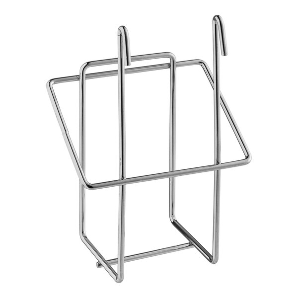 A Regency chrome metal glove box holder with clips on a metal shelf.