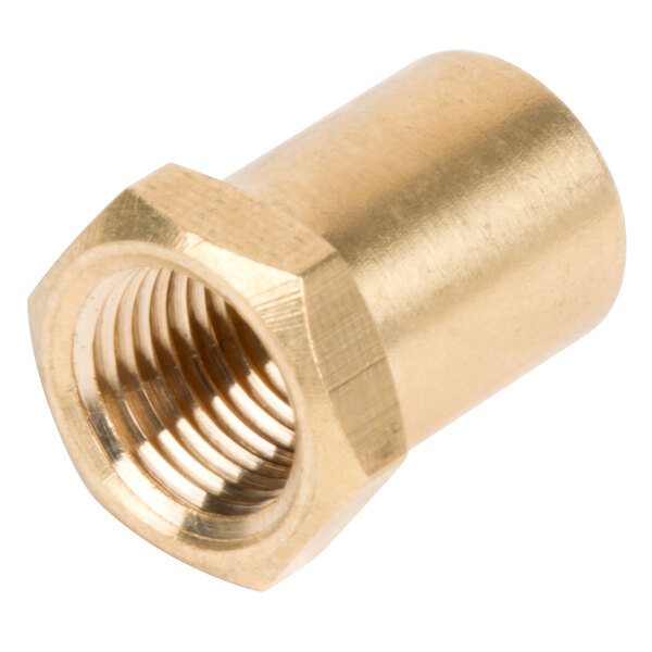 A close-up of a brass threaded nut on a gold piece.