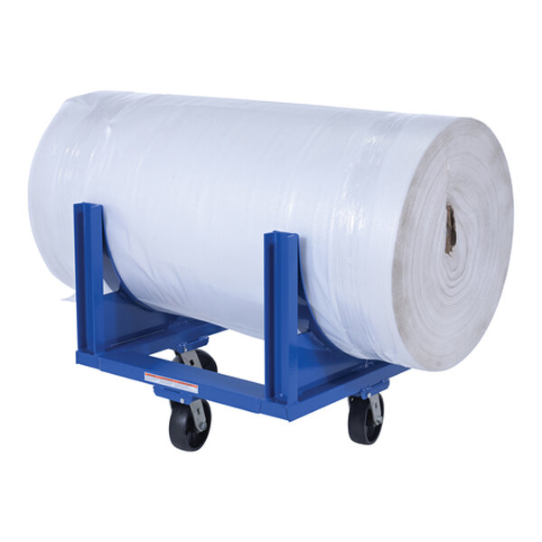 A large roll of material on a blue steel heavy-duty cradle with four caster wheels.