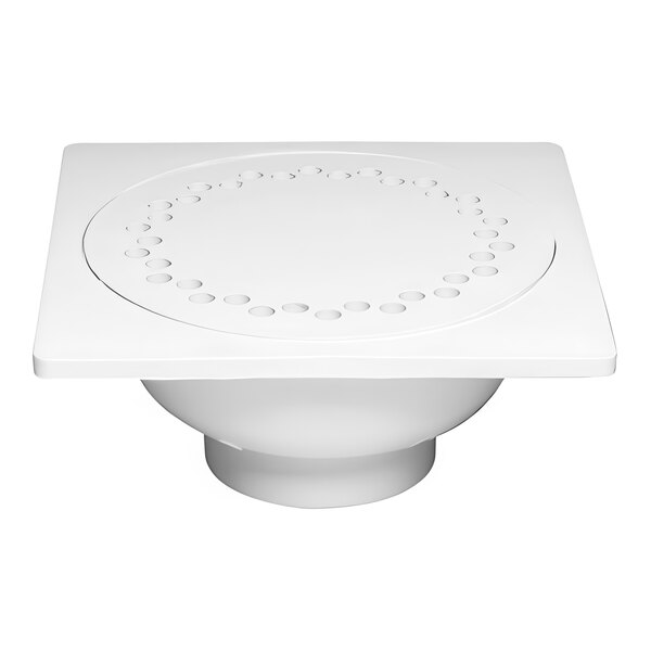 A white square PVC floor drain with a circular design.