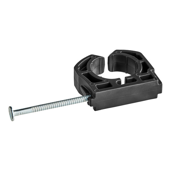 A black plastic Oatey pipe clamp with a nail.