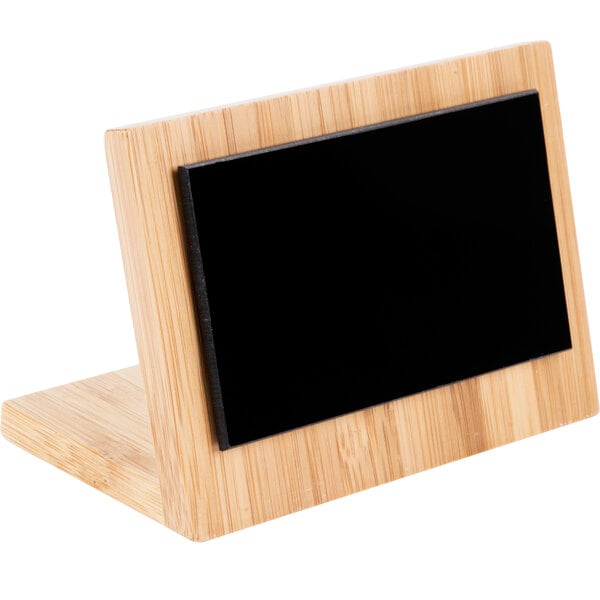 A Cal-Mil bamboo tabletop tent with a wooden frame and black rectangular screen.