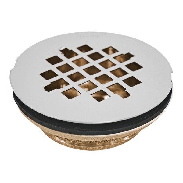 The round metal grid for an Oatey brass shower drain with holes.