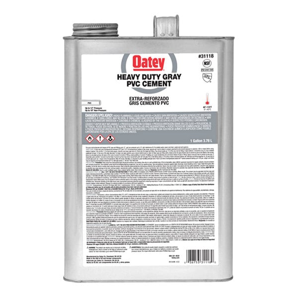 A silver Oatey PVC cement can with a white label.
